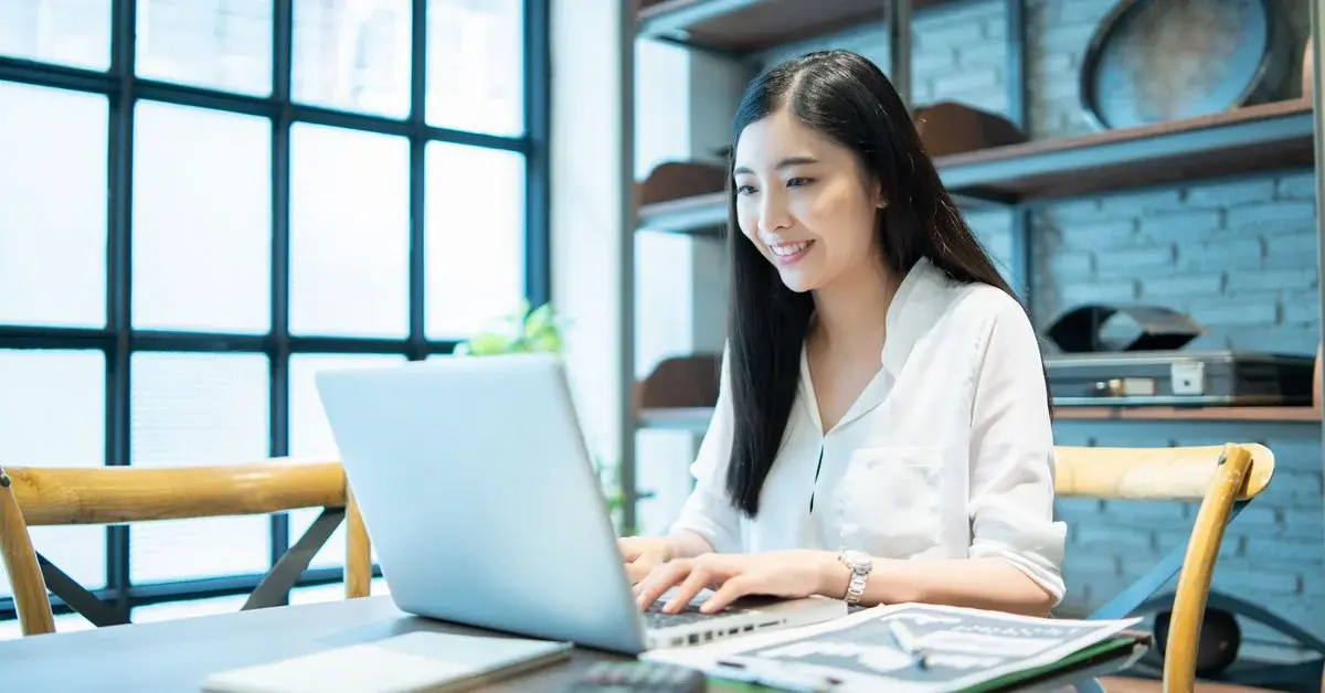 Accountant managing account payables on her laptop